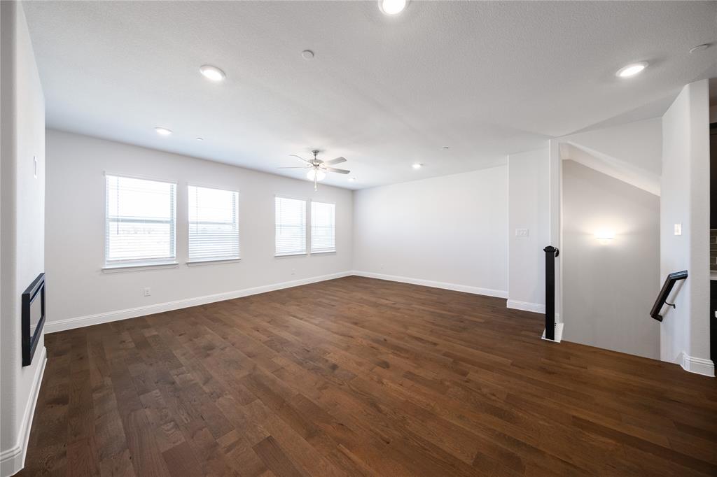 7929 Sunset Boulevard Rowlett, TX 75088 - Photo 5 of 32 a view of empty room with wooden floor and fan