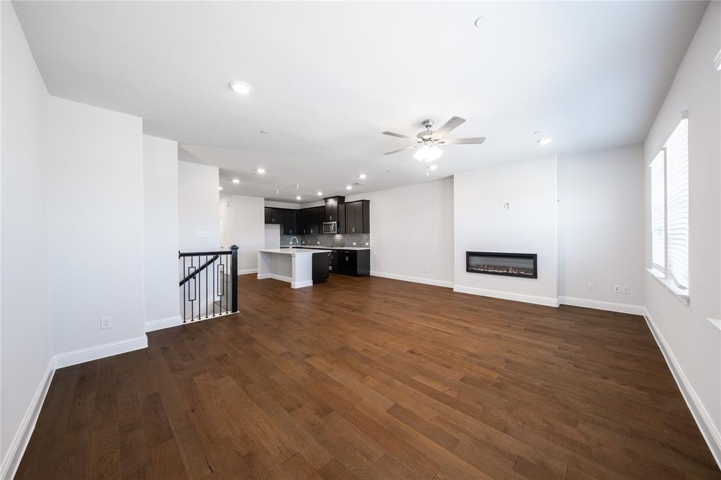 7929 Sunset Boulevard Rowlett, TX 75088 - Photo 6 of 32 a view of kitchen and a sink with wooden floor
