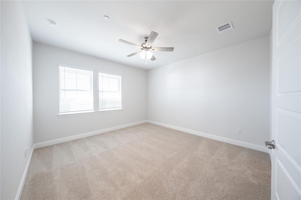 7929 Sunset Boulevard Rowlett, TX 75088 - Photo 7 of 32 a view of an empty room with a window