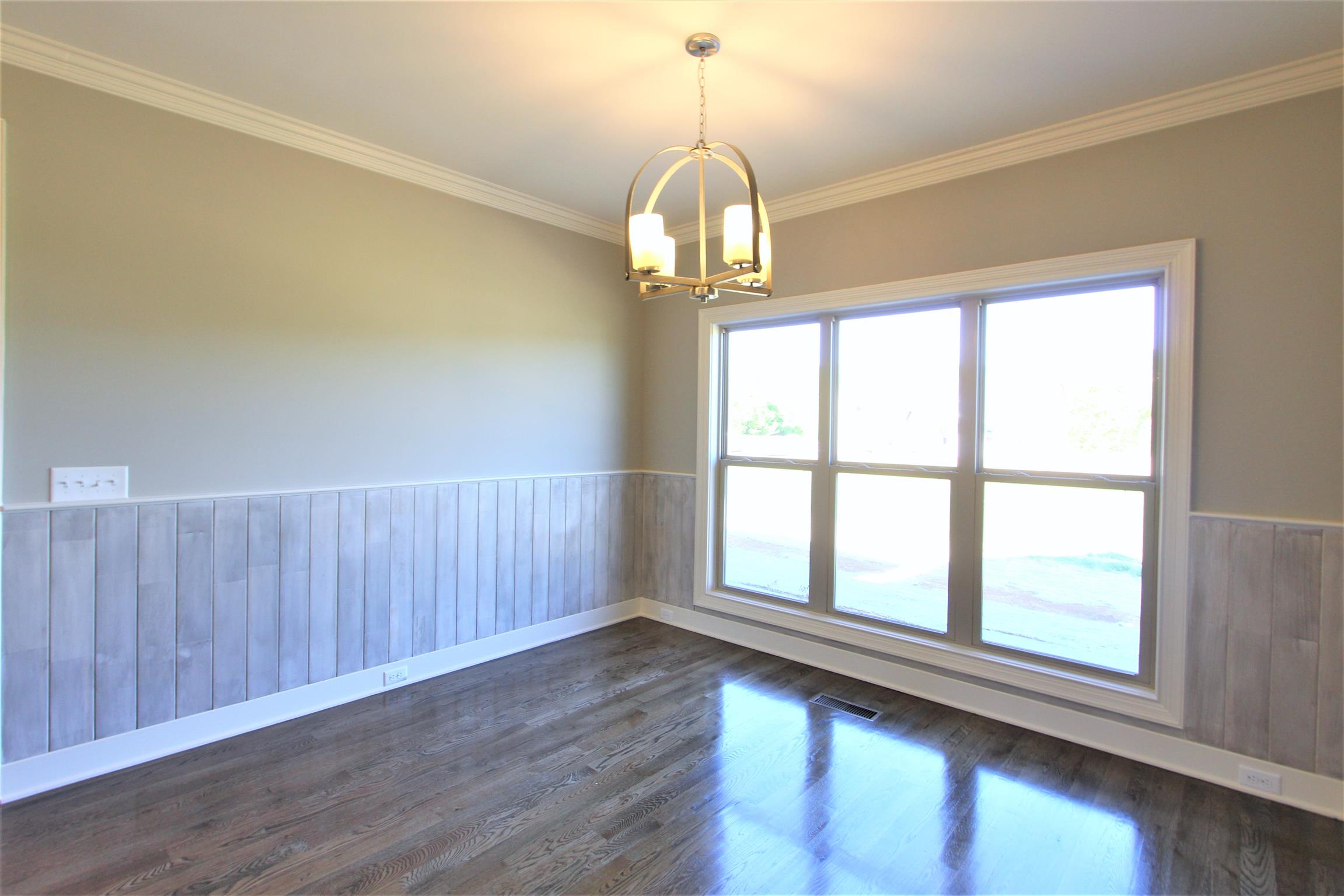 3818 Old Murfreesboro Road West, Unit 5 Lebanon, TN 37090 - Photo 11 of 27 a view of empty room with wooden floor and fan