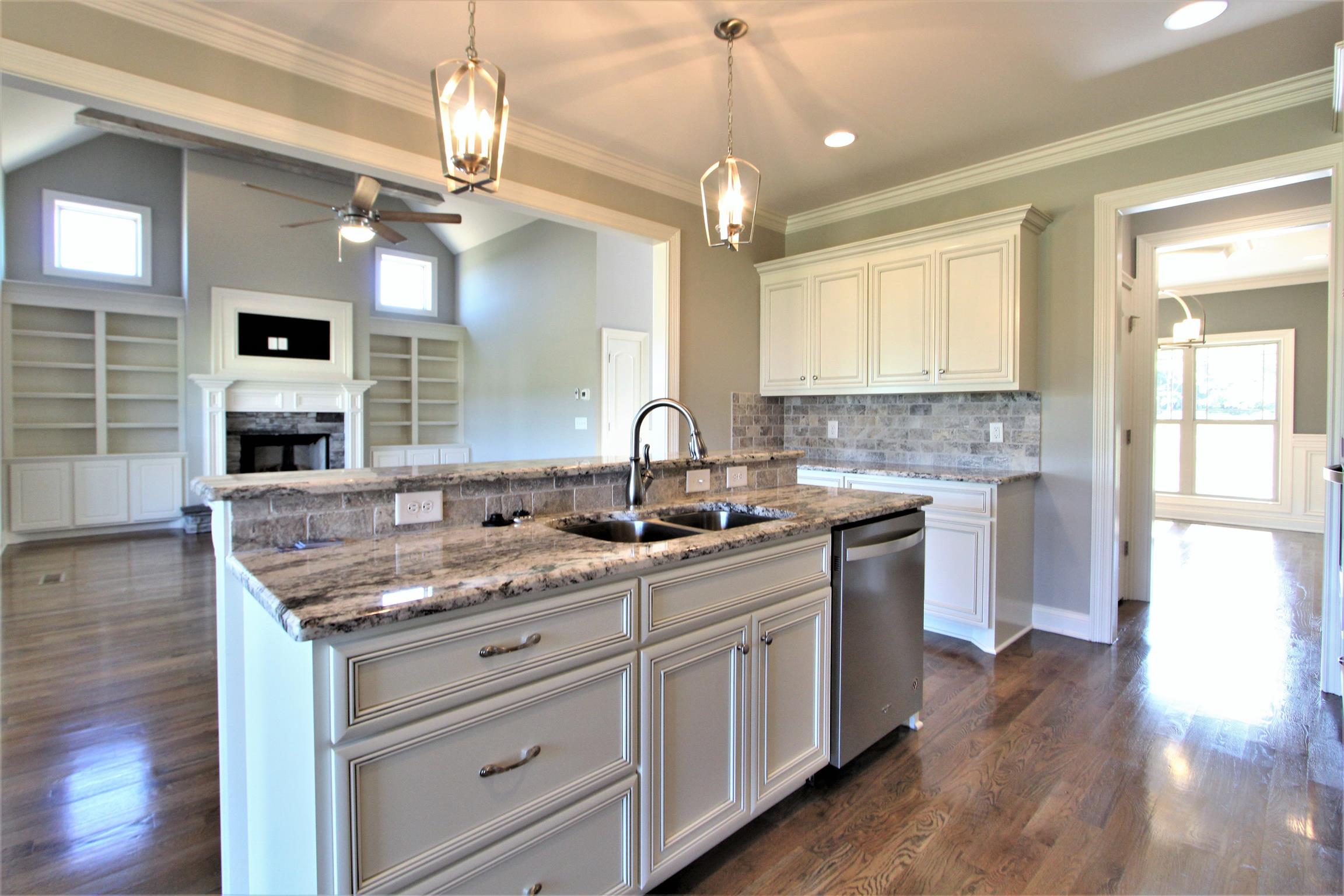 3818 Old Murfreesboro Road West, Unit 5 Lebanon, TN 37090 - Photo 17 of 27 a kitchen with granite countertop a sink stainless steel appliances and cabinets