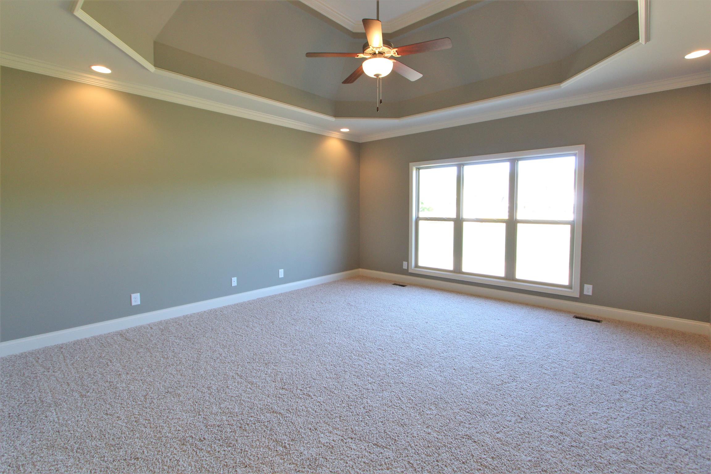 3818 Old Murfreesboro Road West, Unit 5 Lebanon, TN 37090 - Photo 18 of 27 an empty room with windows and ceiling fan