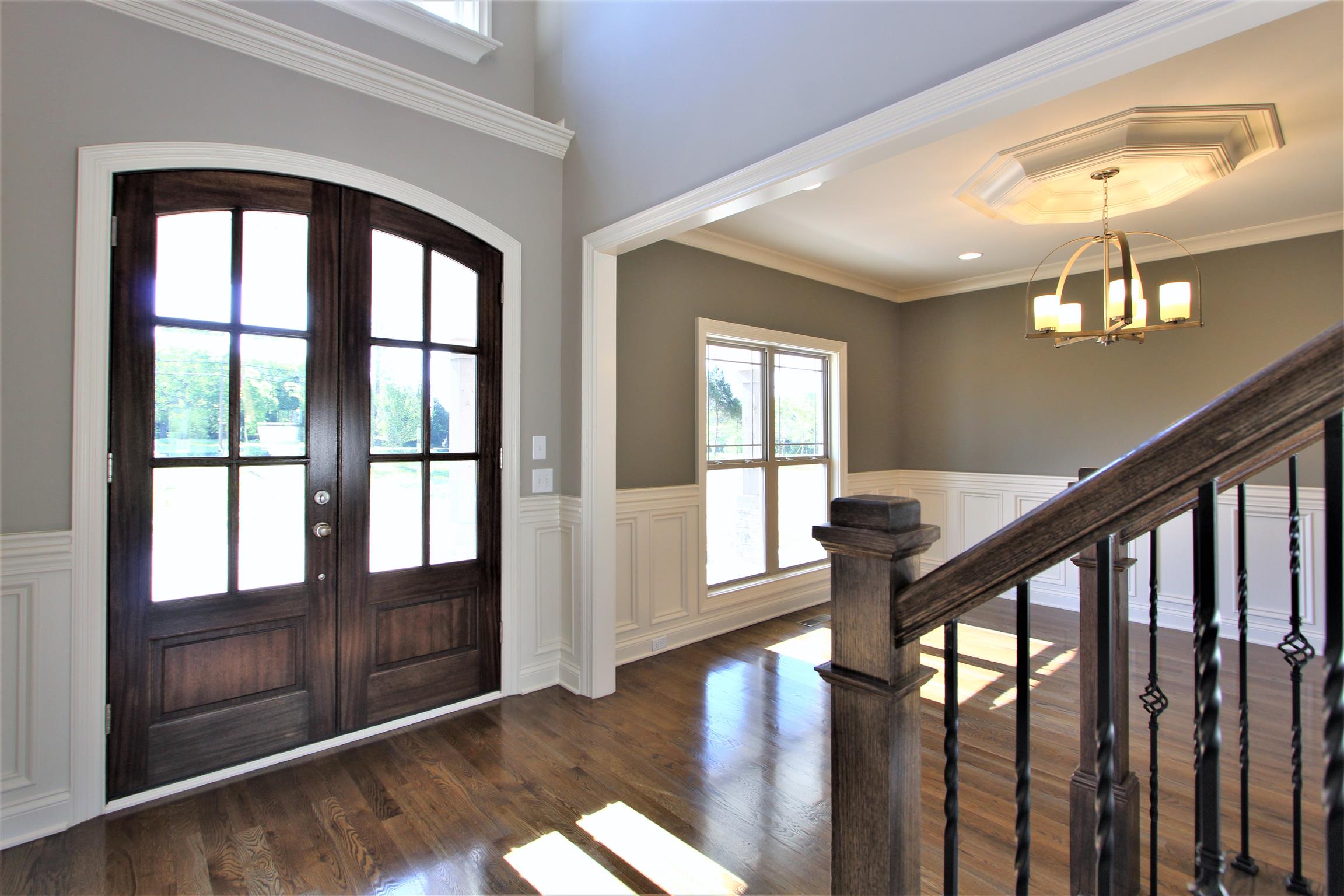 3818 Old Murfreesboro Road West, Unit 5 Lebanon, TN 37090 - Photo 2 of 27 a view of an entryway with wooden floor and chandelier