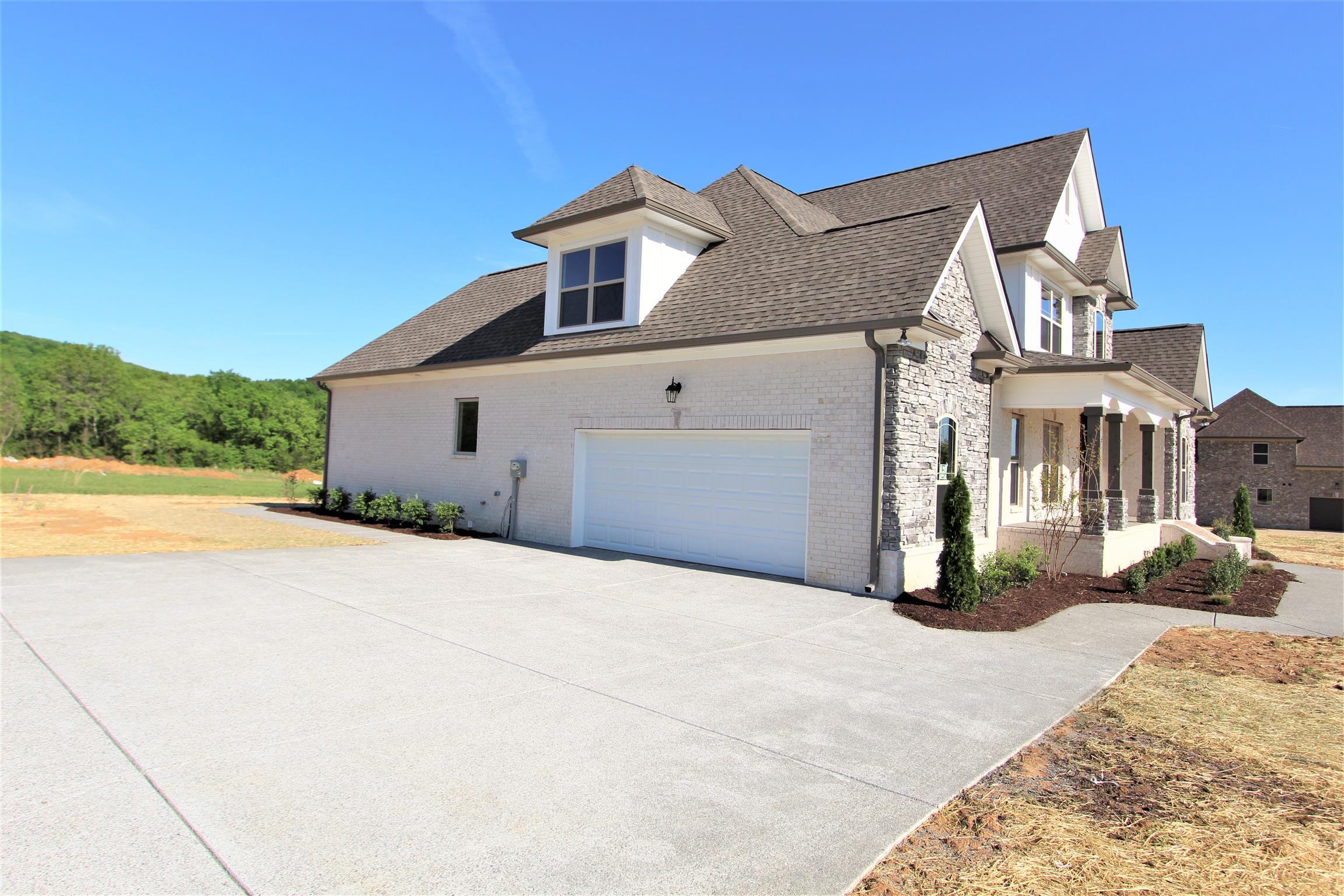 3818 Old Murfreesboro Road West, Unit 5 Lebanon, TN 37090 - Photo 27 of 27 a front view of a house with a yard