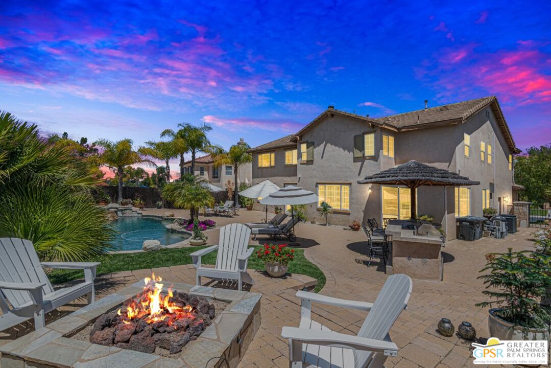 45211 Willowick Street Temecula, CA 92592 - Photo 1 of 69 a view of a chairs and tables in the back yard of the house