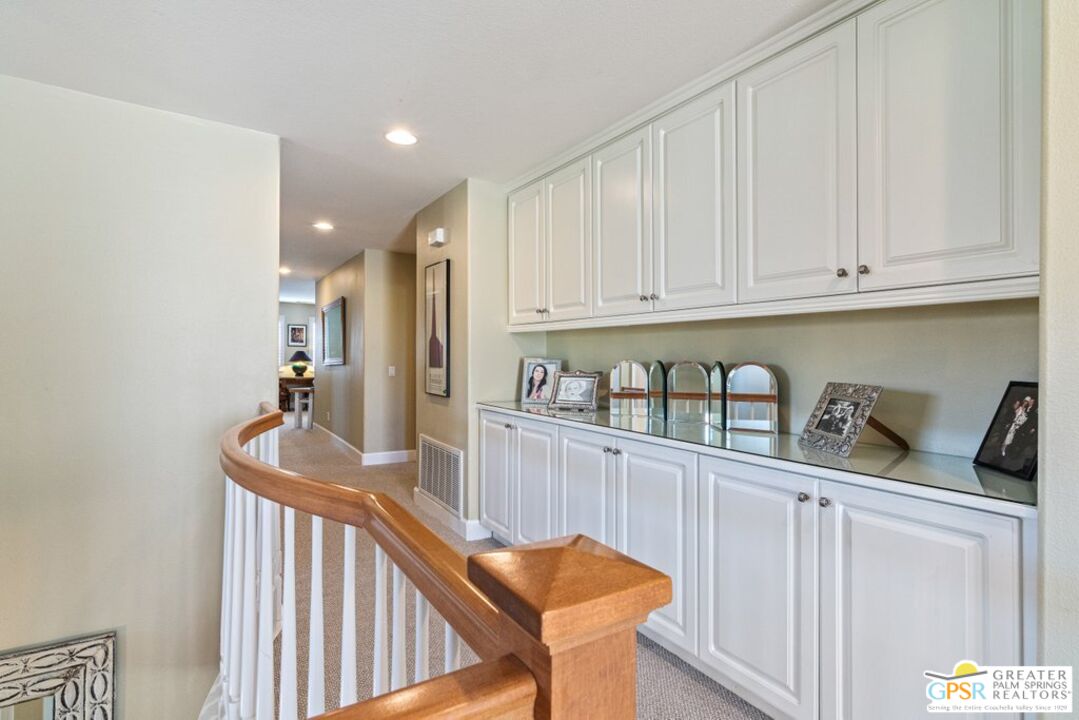 45211 Willowick Street Temecula, CA 92592 - Photo 24 of 69 a kitchen with granite countertop white cabinets and sink