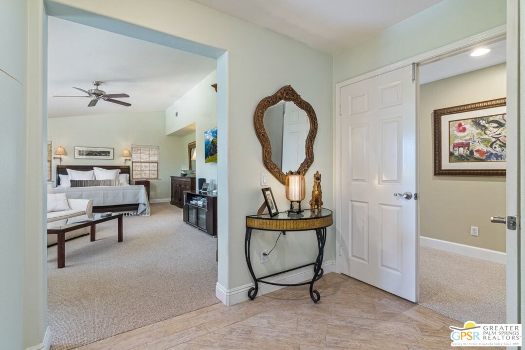 45211 Willowick Street Temecula, CA 92592 - Photo 27 of 69 a living room with furniture a rug and white walls