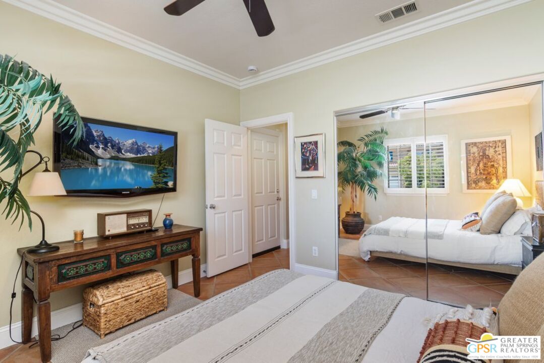 45211 Willowick Street Temecula, CA 92592 - Photo 32 of 69 a bedroom with furniture and a flat screen tv