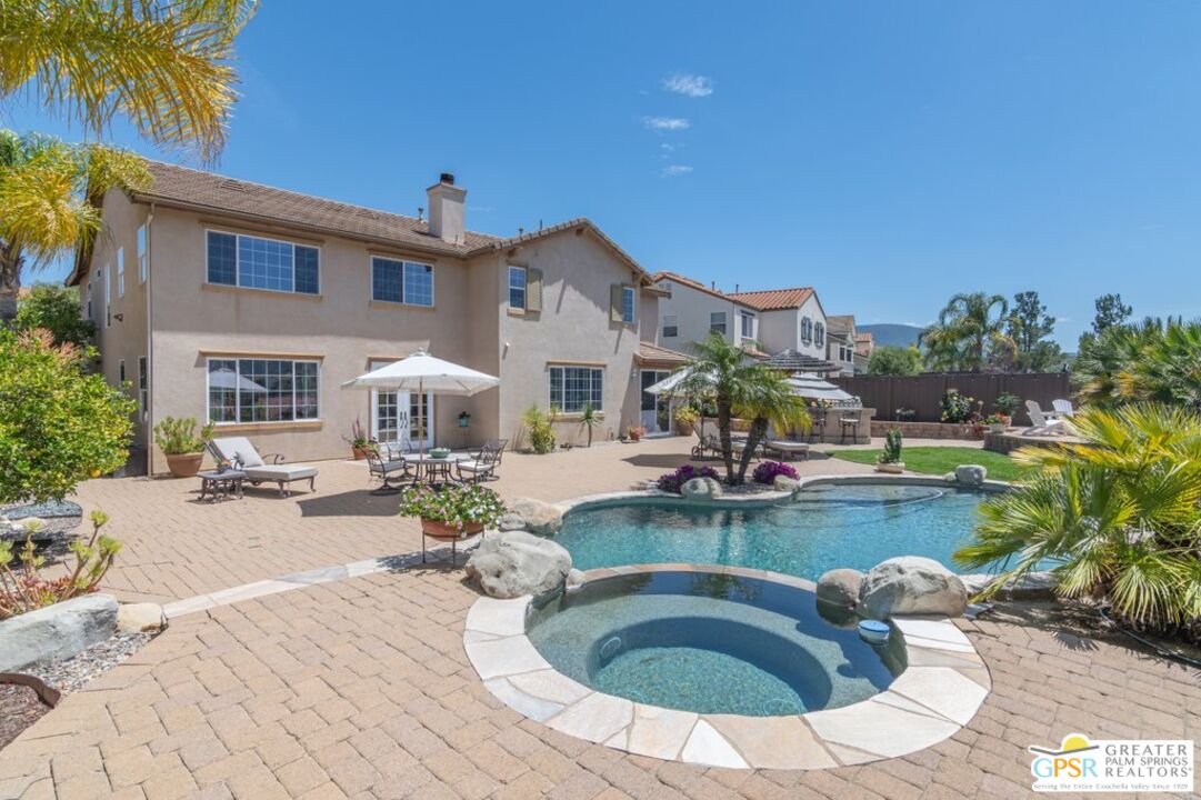 45211 Willowick Street Temecula, CA 92592 - Photo 57 of 69 a view of a house with swimming pool and sitting area