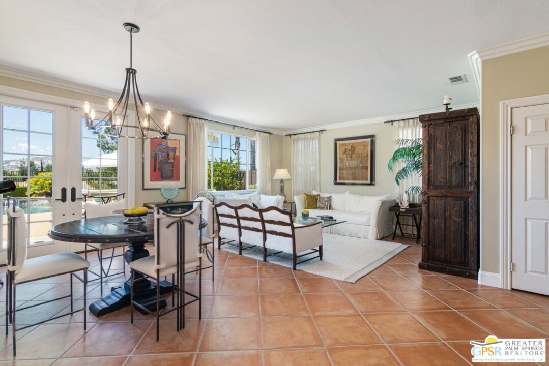 45211 Willowick Street Temecula, CA 92592 - Photo 8 of 69 a living room with furniture a chandelier and a dining table
