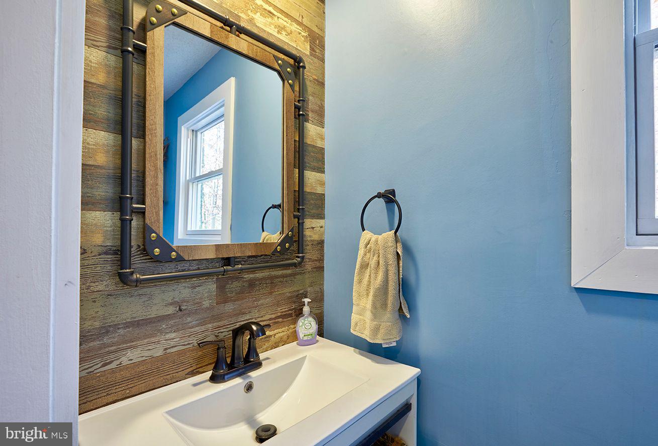443 Pricketts Mill Road Tabernacle, NJ 08088 - Photo 13 of 37 a bathroom with a sink and a mirror