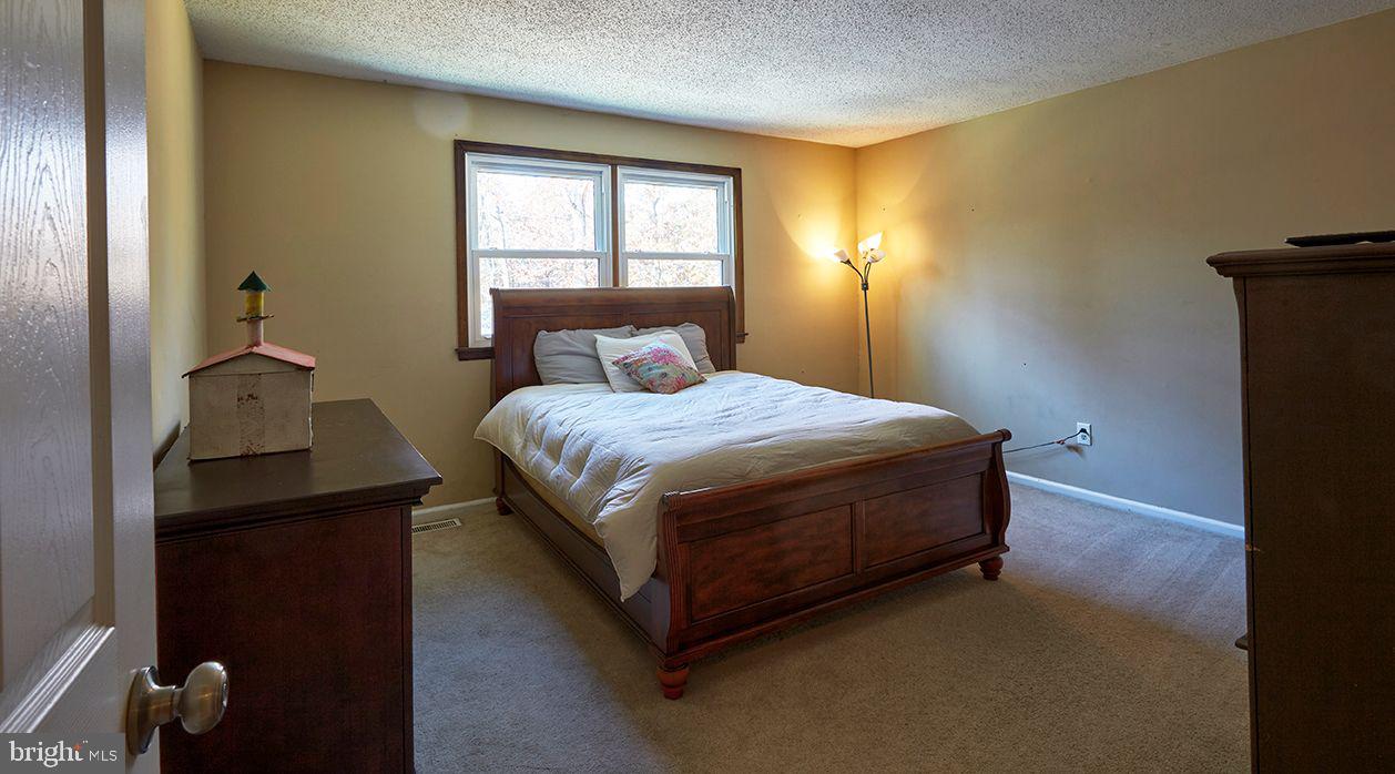 443 Pricketts Mill Road Tabernacle, NJ 08088 - Photo 22 of 37 a bedroom with a bed and a window