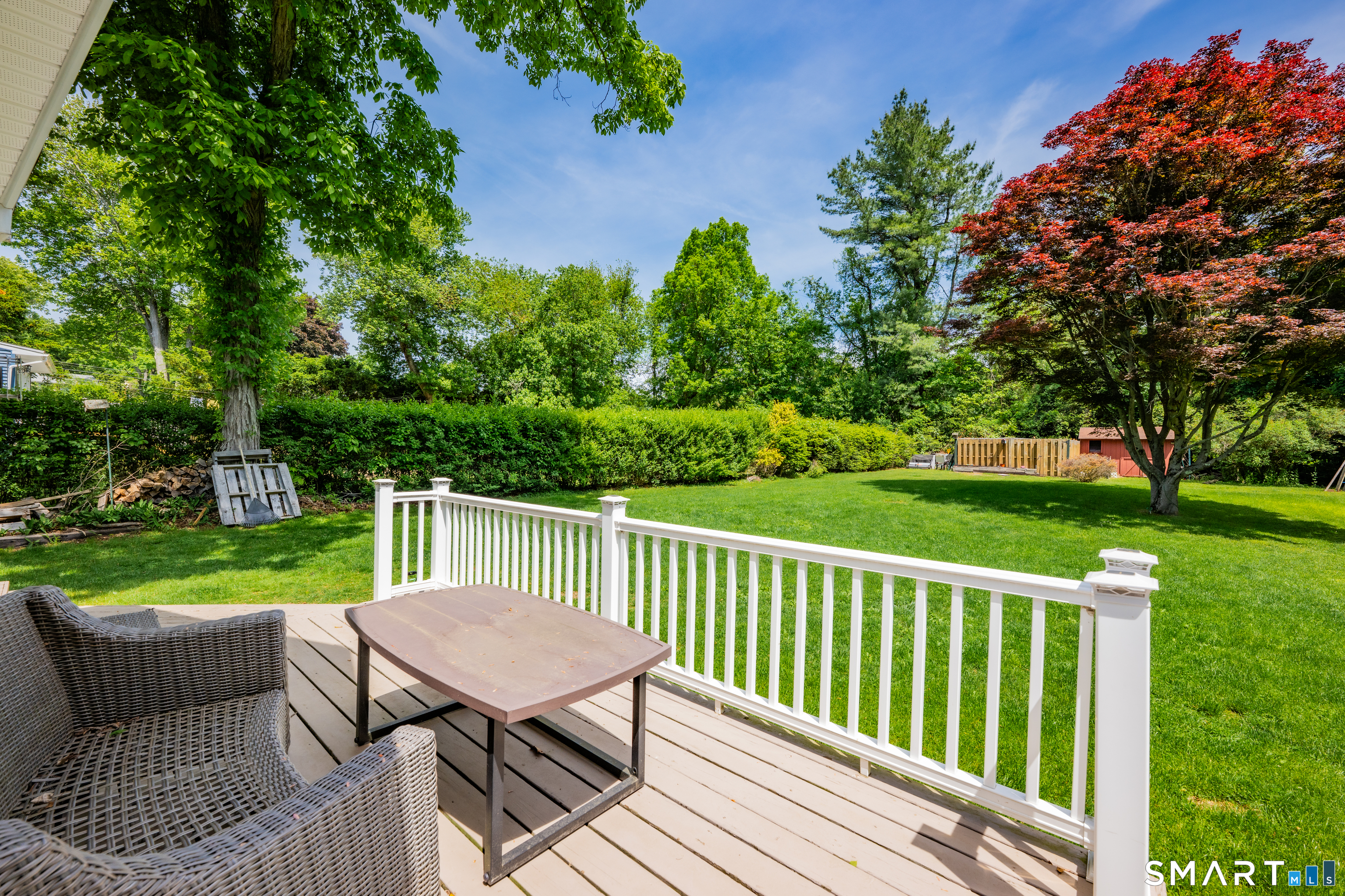 2 Hemlock Road Prospect, CT 06712 - Photo 23 of 27 a view of a table and chairs on the deck