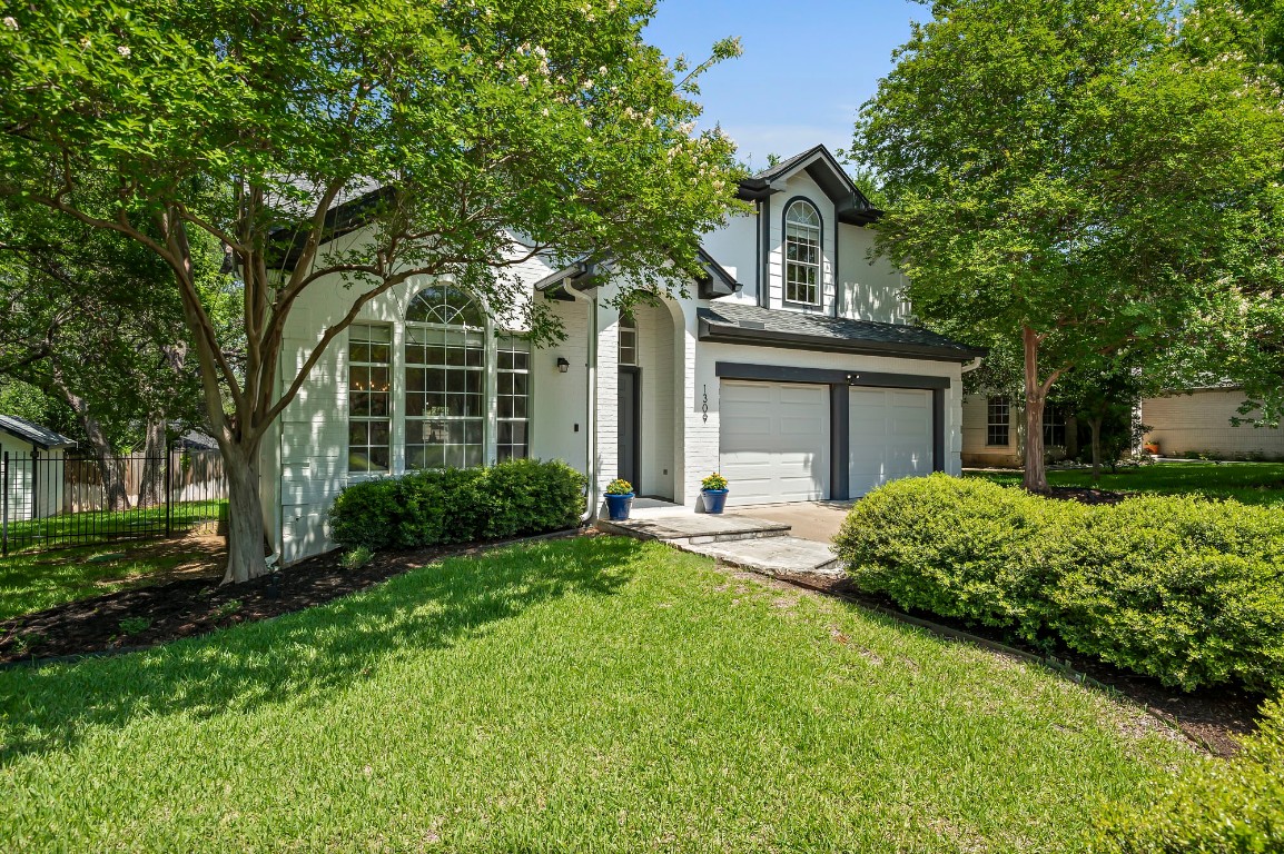 1309 Olympus Drive Austin, TX 78733 - Photo 1 of 1 front view of a house with a yard