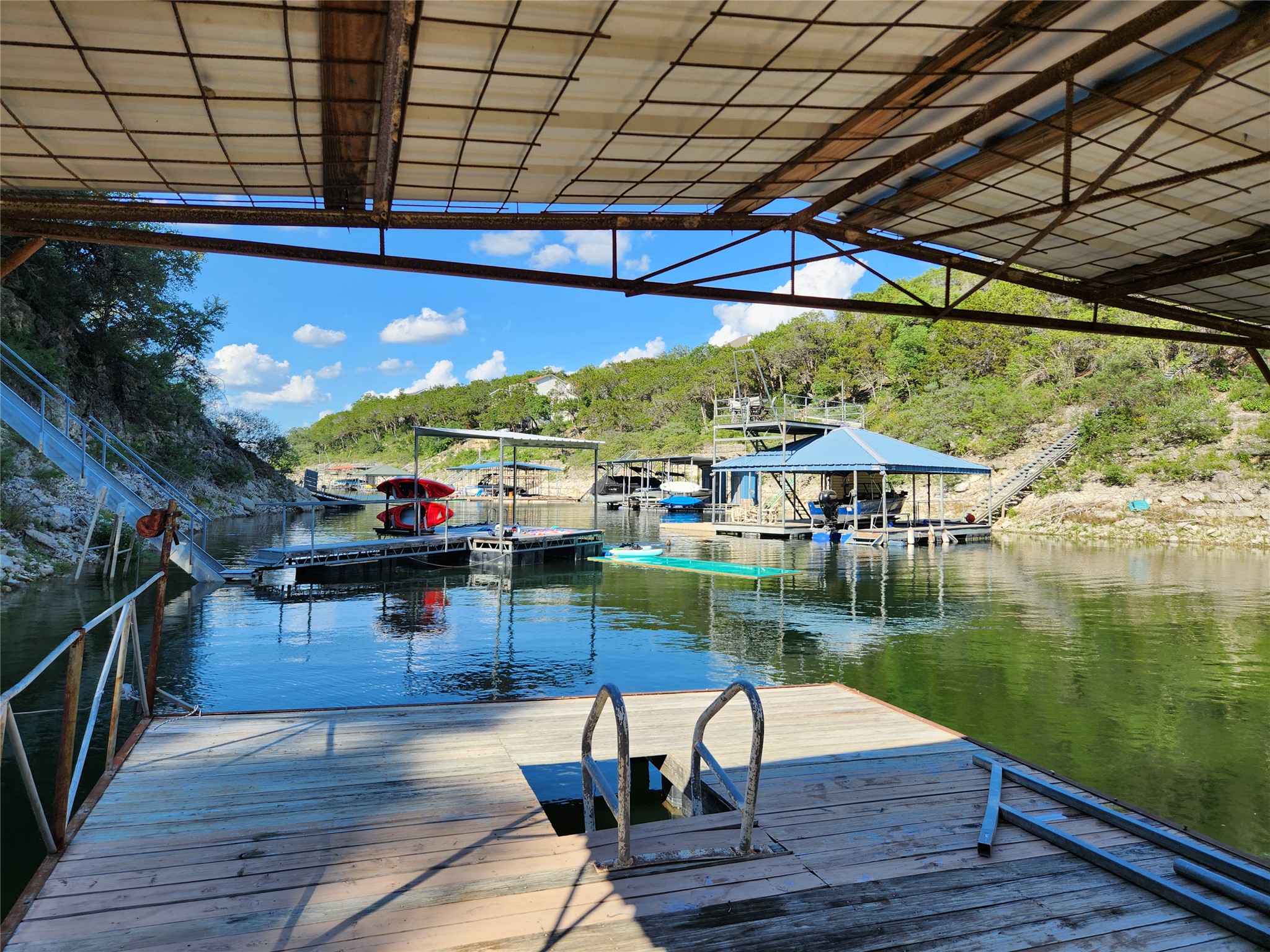 3807 Boat Dock Road Lago Vista, TX 78645 - Photo 25 of 37 A tranquil lakefront setting offers private boat slips and stunning views of lush, rolling hills.