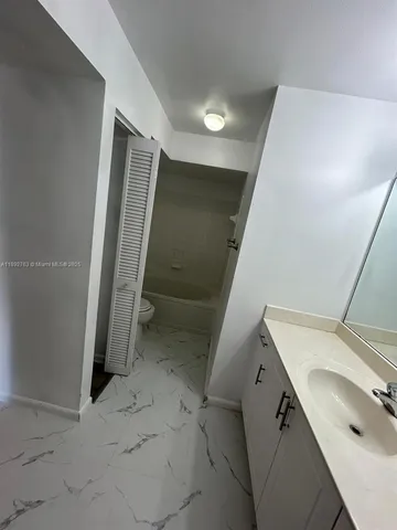 a view of a storage & utility room with a sink