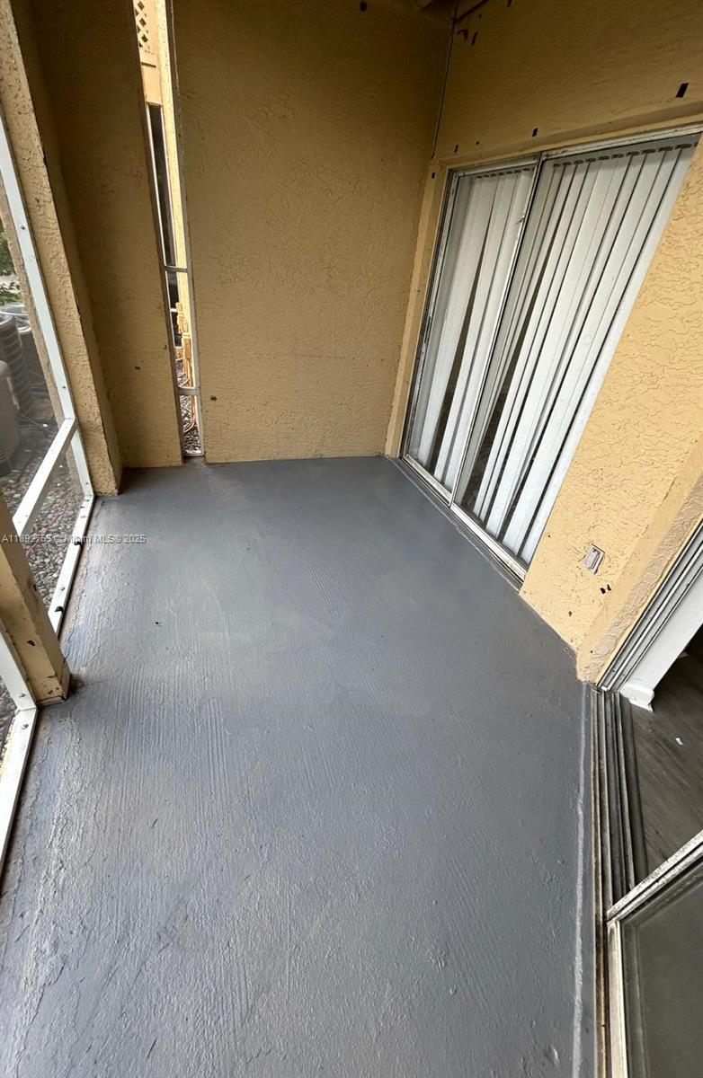 4815 Via Palm Lakes, Unit 1411 West Palm Beach, FL 33417 - Photo 10 of 11 a view of a room with windows