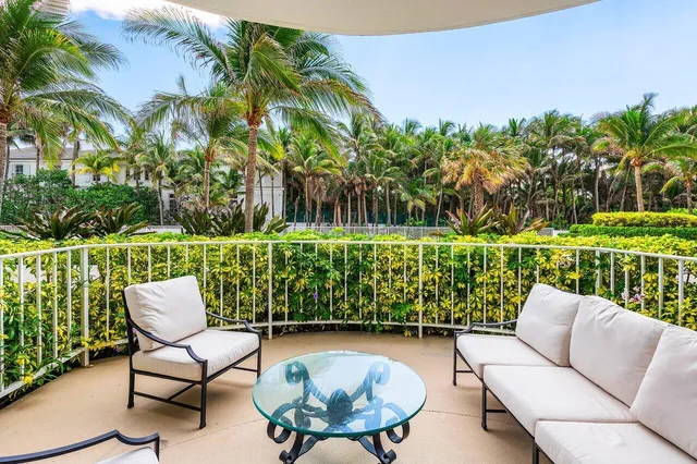 a view of a chairs in patio with a yard