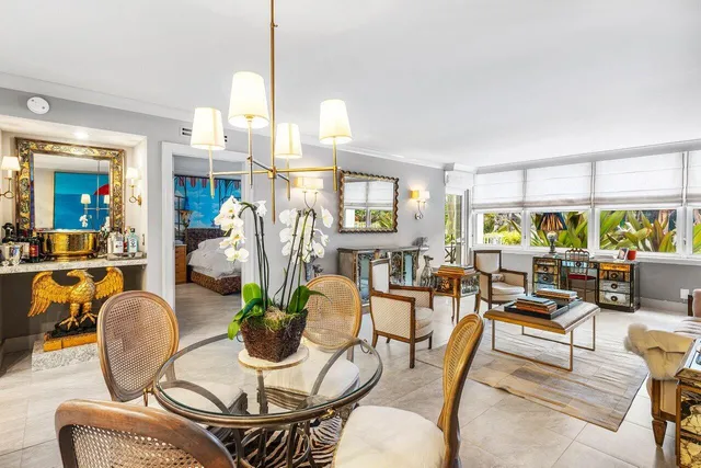 a living room with furniture a window and kitchen view