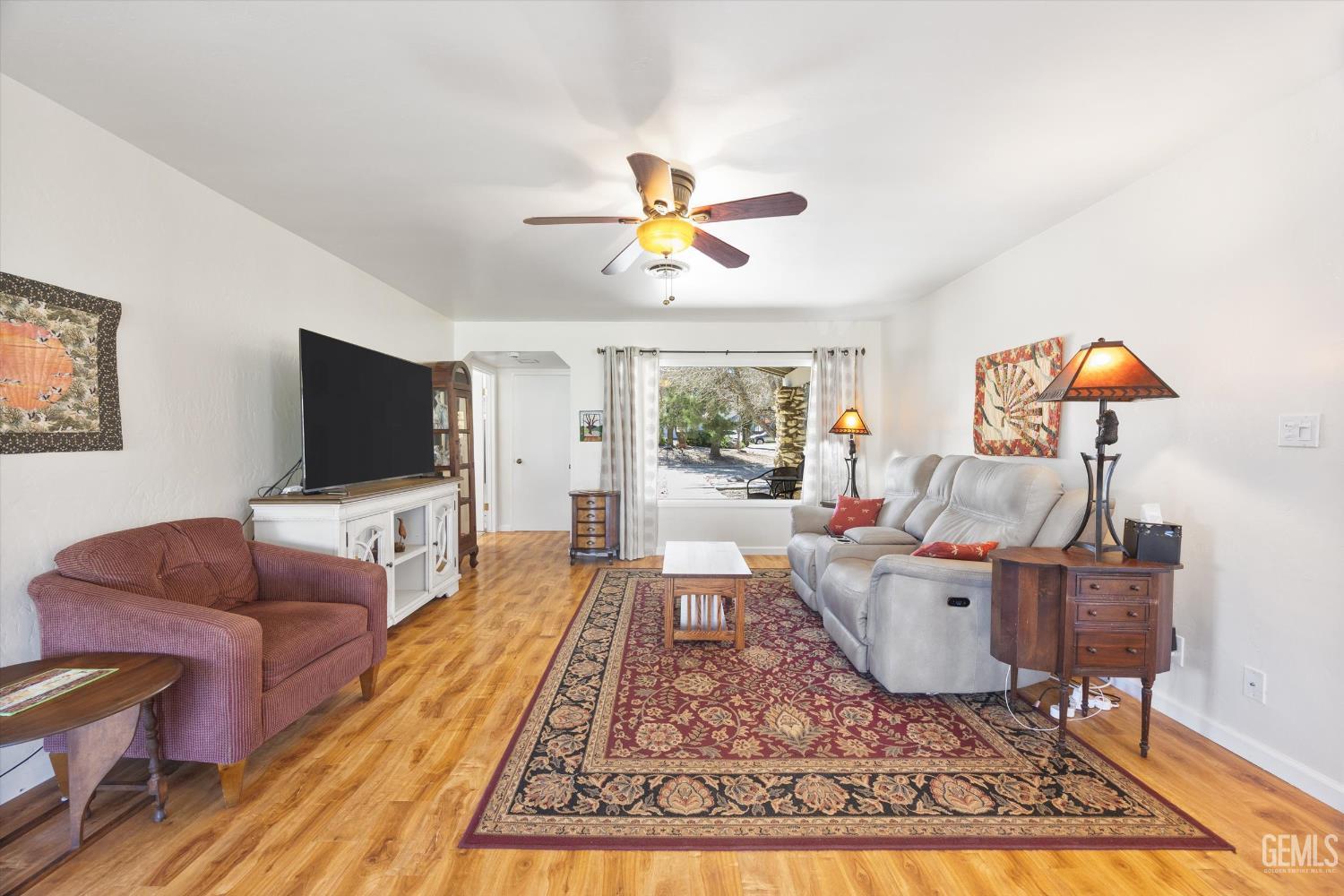 Undisclosed Address Tehachapi, CA 93561 - Photo 11 of 48 a living room with furniture and a flat screen tv