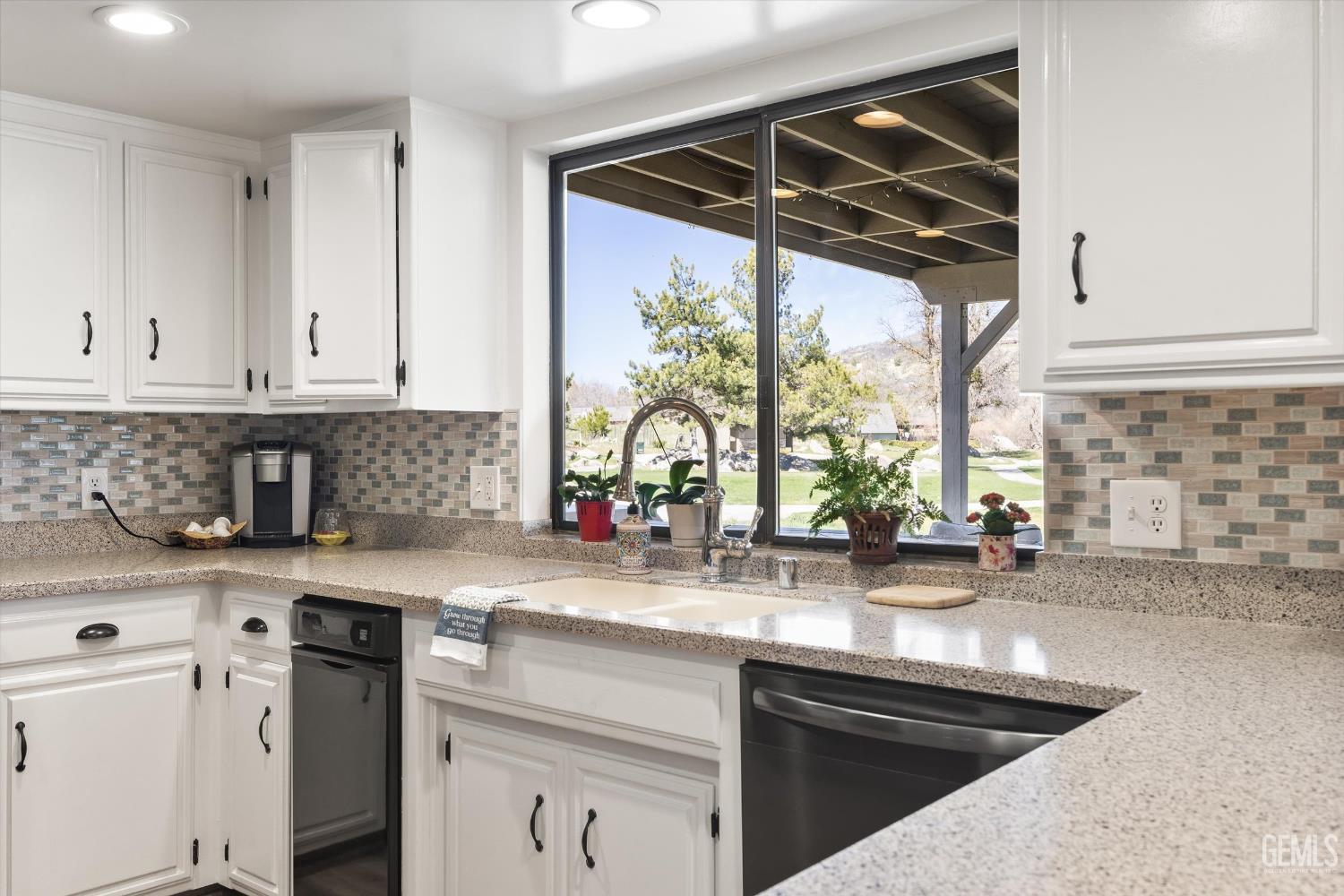 Undisclosed Address Tehachapi, CA 93561 - Photo 17 of 48 a kitchen with stainless steel appliances a sink a stove and cabinets