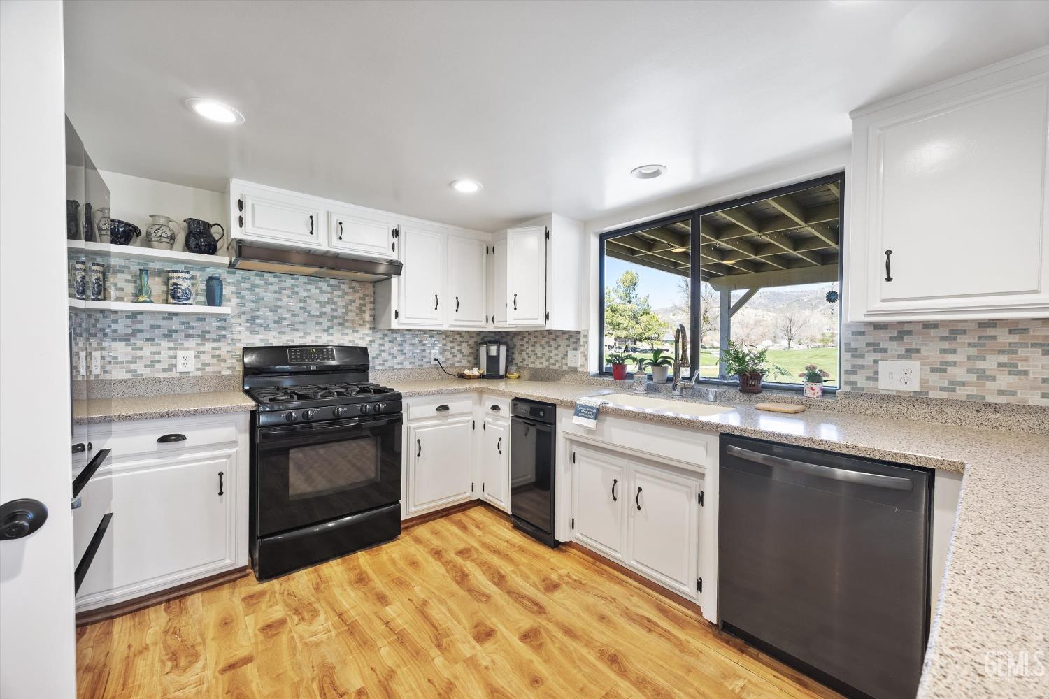 Undisclosed Address Tehachapi, CA 93561 - Photo 20 of 48 a kitchen with a sink stove and refrigerator