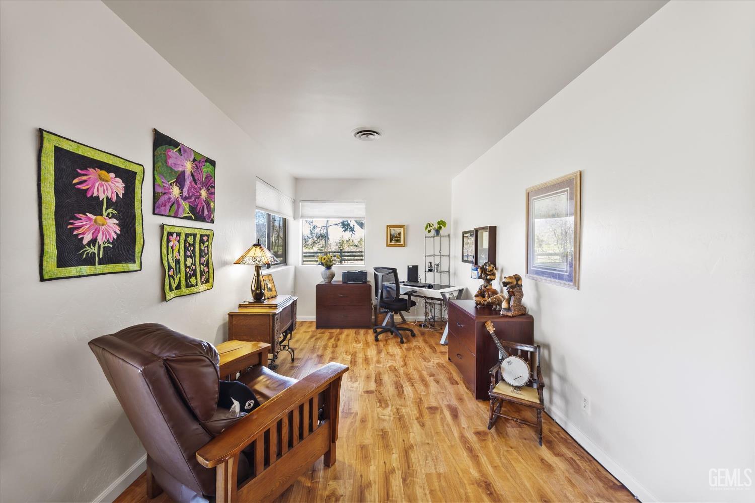 Undisclosed Address Tehachapi, CA 93561 - Photo 21 of 48 a living room with furniture and wooden floor