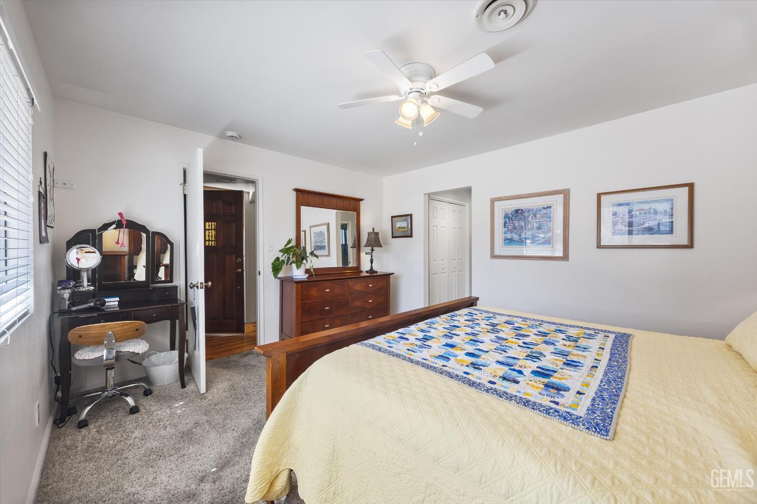 Undisclosed Address Tehachapi, CA 93561 - Photo 24 of 48 a bedroom with a bed and a chandelier