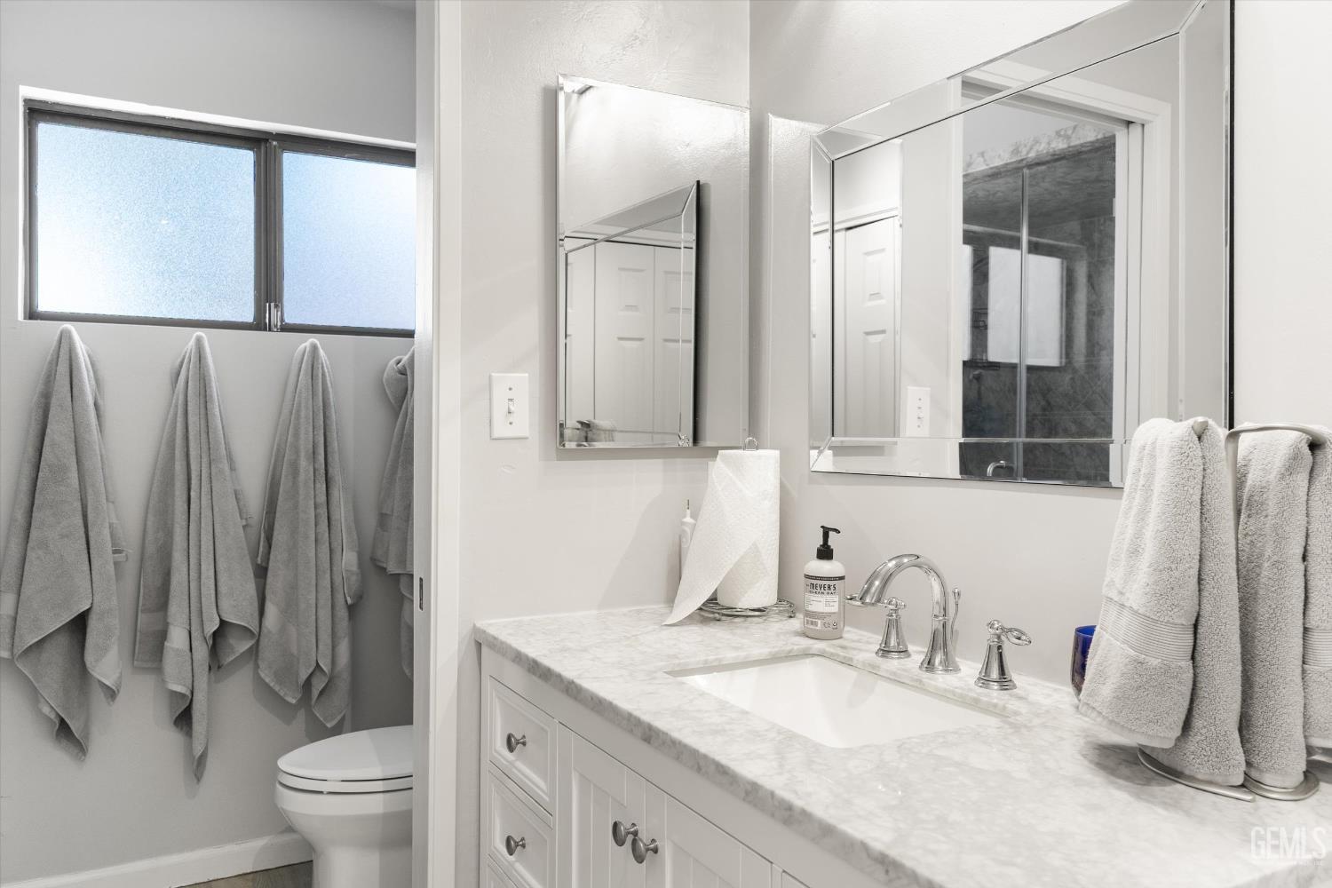 Undisclosed Address Tehachapi, CA 93561 - Photo 25 of 48 a bathroom with a granite countertop sink toilet and shower
