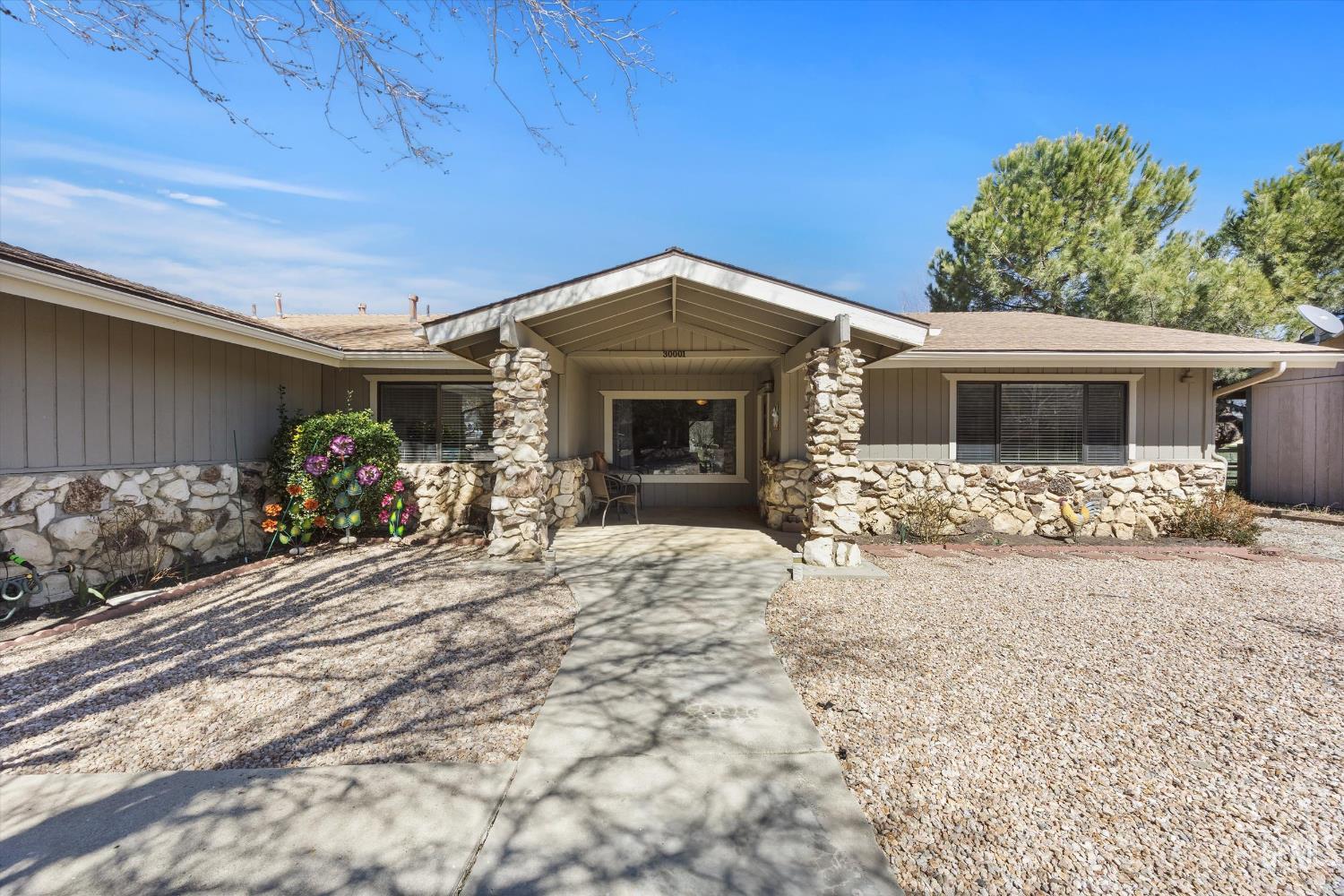 Undisclosed Address Tehachapi, CA 93561 - Photo 7 of 48 a front view of a house with a yard and garage