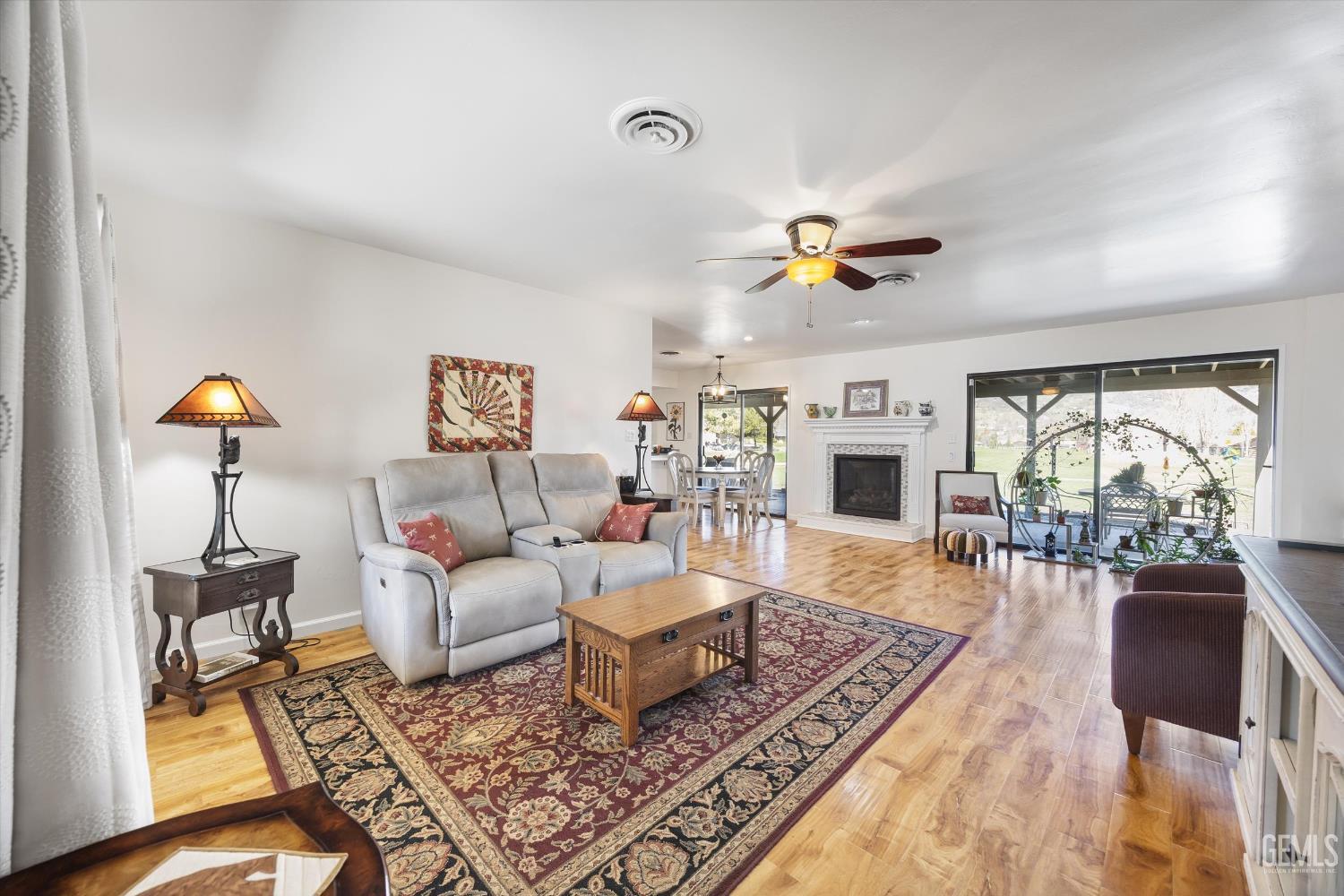 Undisclosed Address Tehachapi, CA 93561 - Photo 9 of 48 a living room with furniture a fireplace and a table