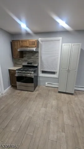 a view of a house with wooden deck