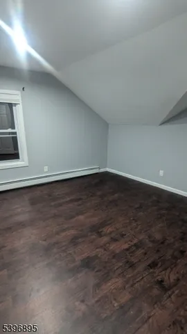 a view of empty room with walk in closet