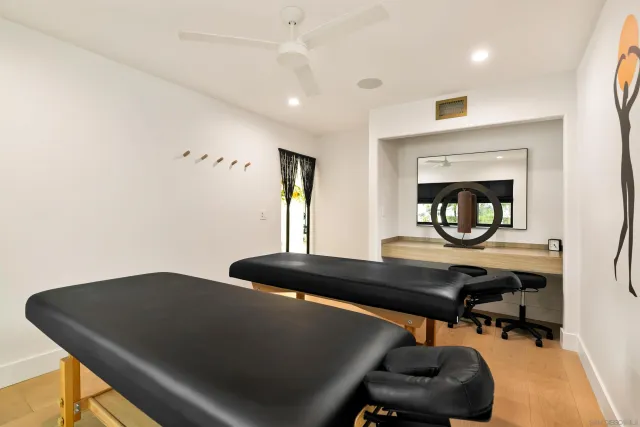 a front view of a house with swimming pool having outdoor seating