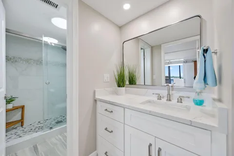 a bathroom with a sink and a mirror