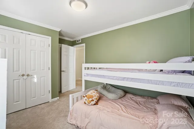 a bedroom with a bed and a cabinets