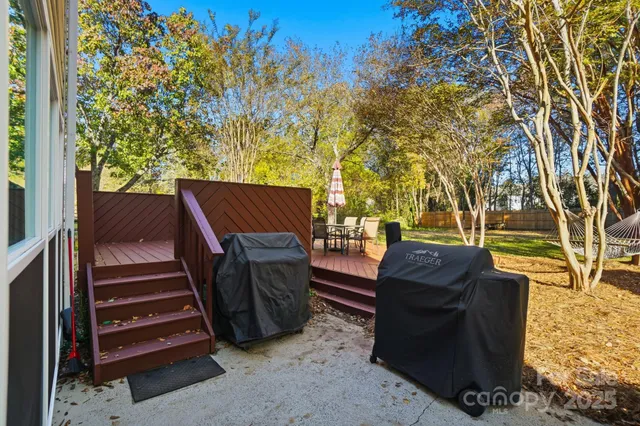a view of a backyard with chairs