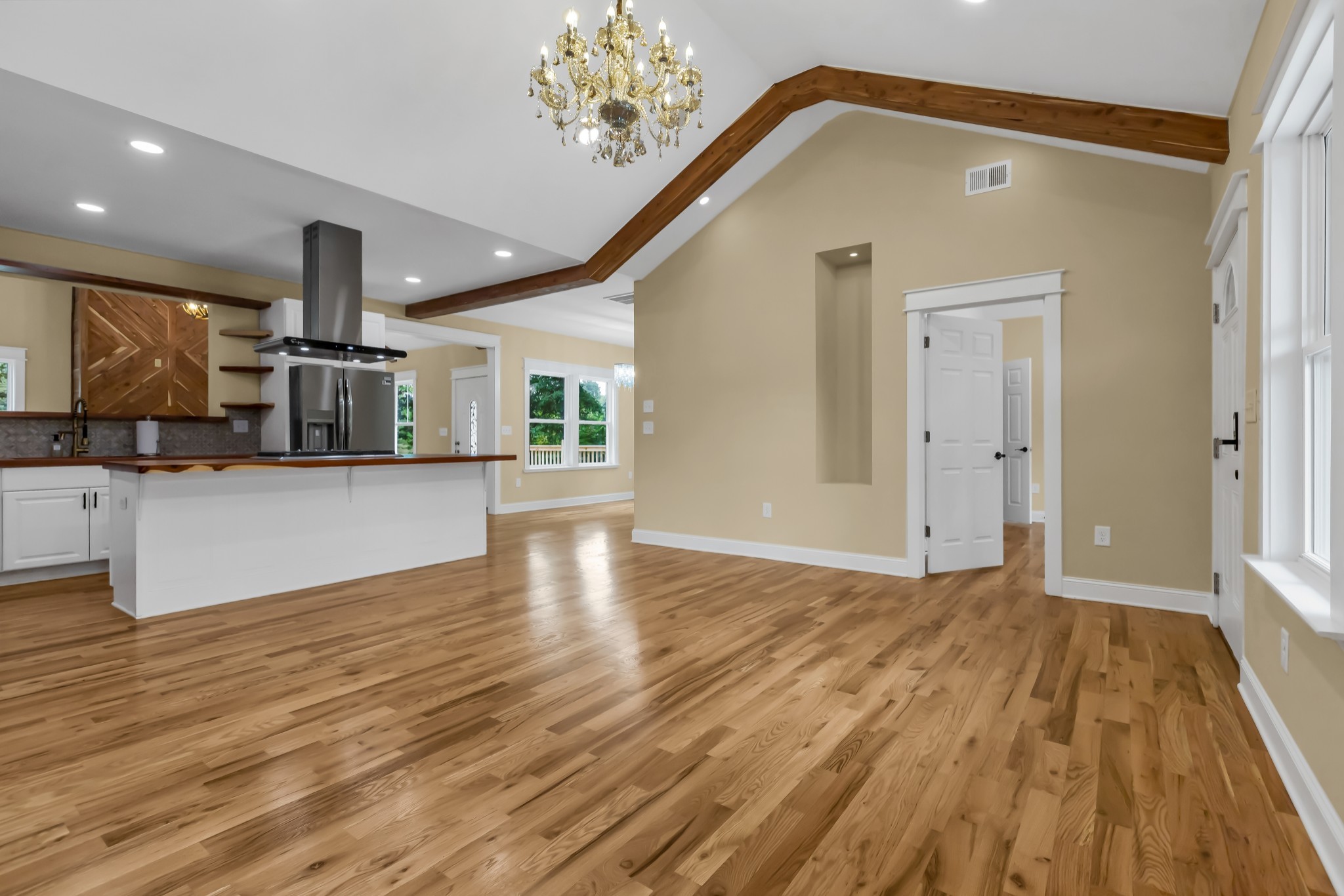 2250 Wayne Road Bon Aqua, TN 37025 - Photo 13 of 48 a view of a kitchen with a sink and dishwasher with wooden floor