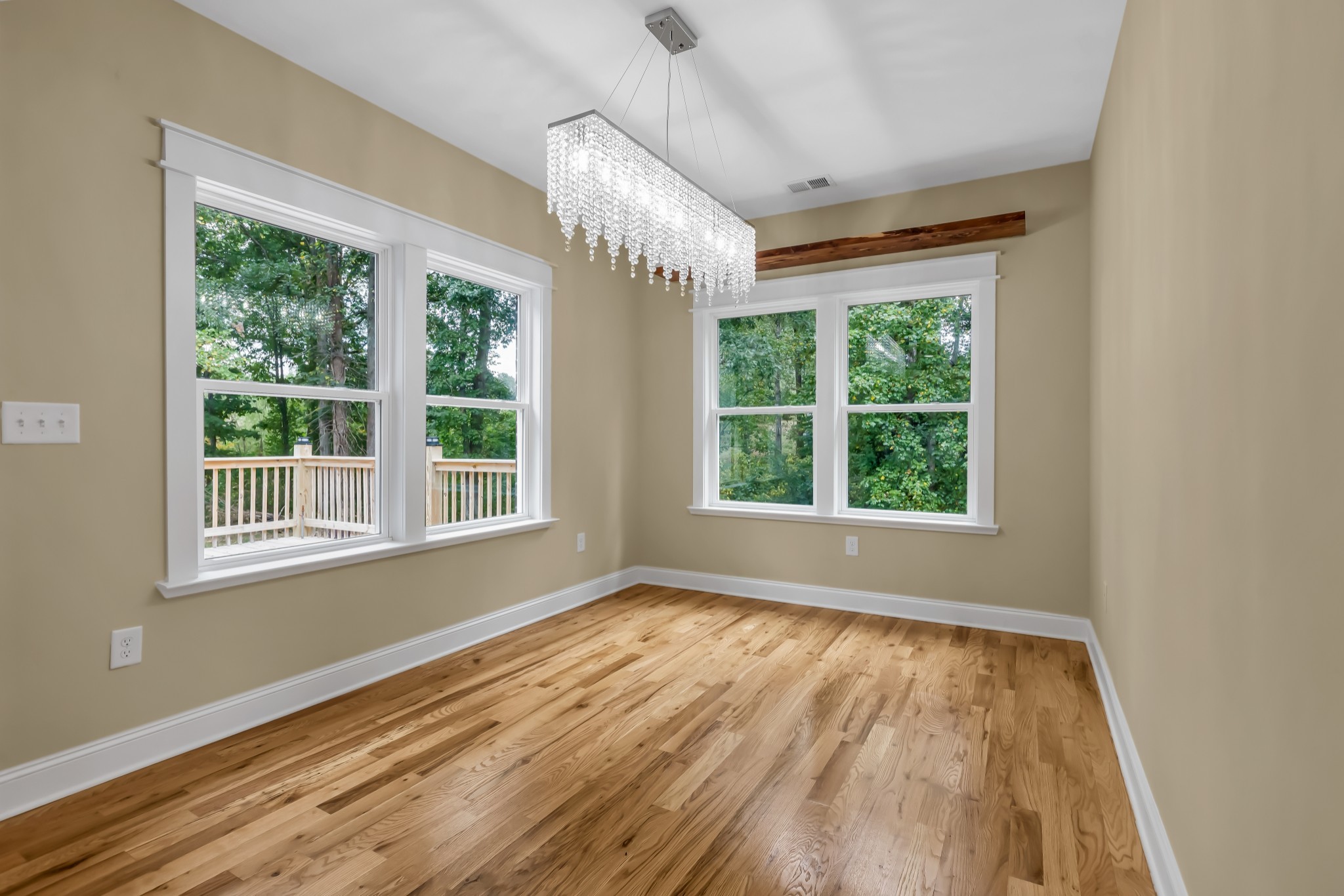 2250 Wayne Road Bon Aqua, TN 37025 - Photo 19 of 48 a view of an empty room with wooden floor and a window