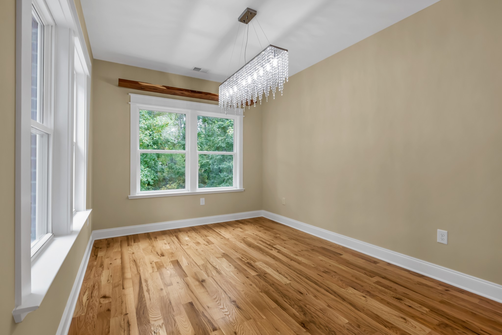 2250 Wayne Road Bon Aqua, TN 37025 - Photo 20 of 48 a view of an empty room with wooden floor and a window