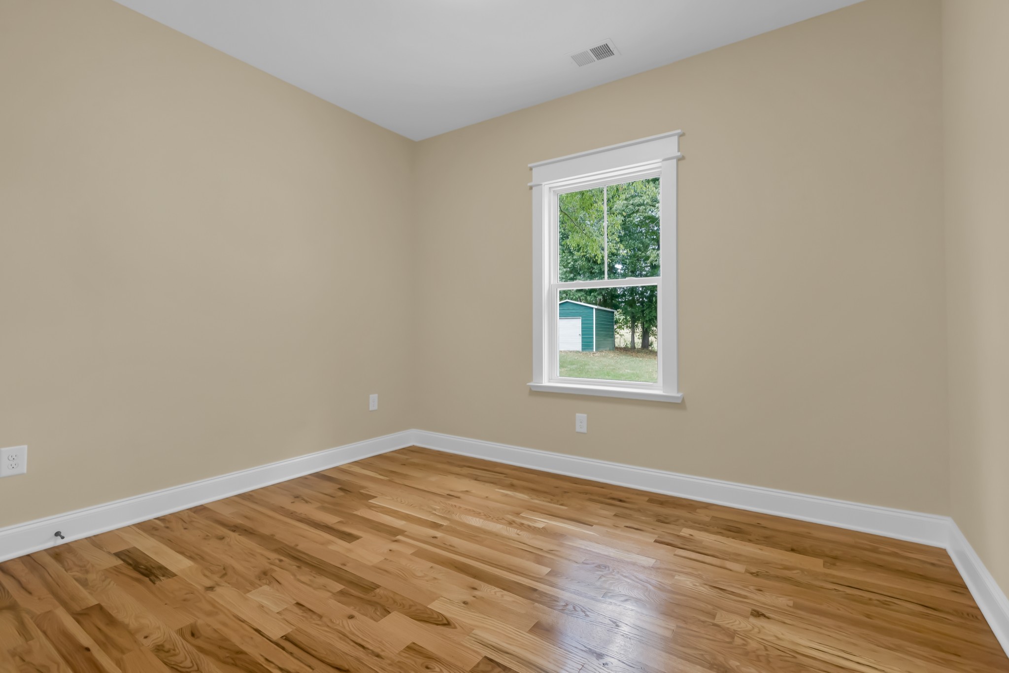 2250 Wayne Road Bon Aqua, TN 37025 - Photo 31 of 48 a view of a room with wooden floor and window