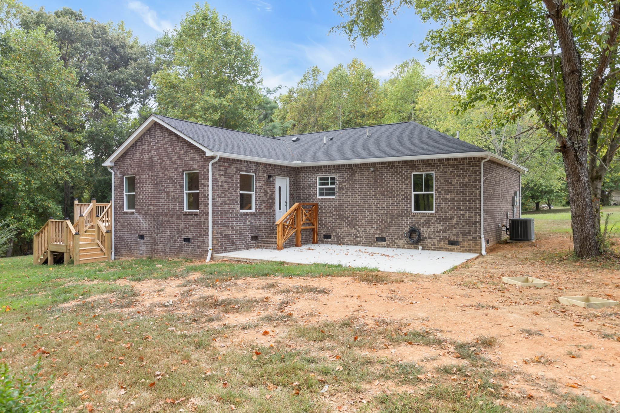 2250 Wayne Road Bon Aqua, TN 37025 - Photo 40 of 48 a front view of a house with a yard and garage