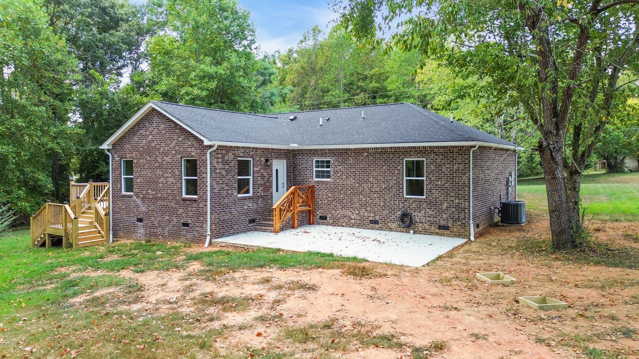 2250 Wayne Road Bon Aqua, TN 37025 - Photo 42 of 48 a front view of a house with a yard and garage