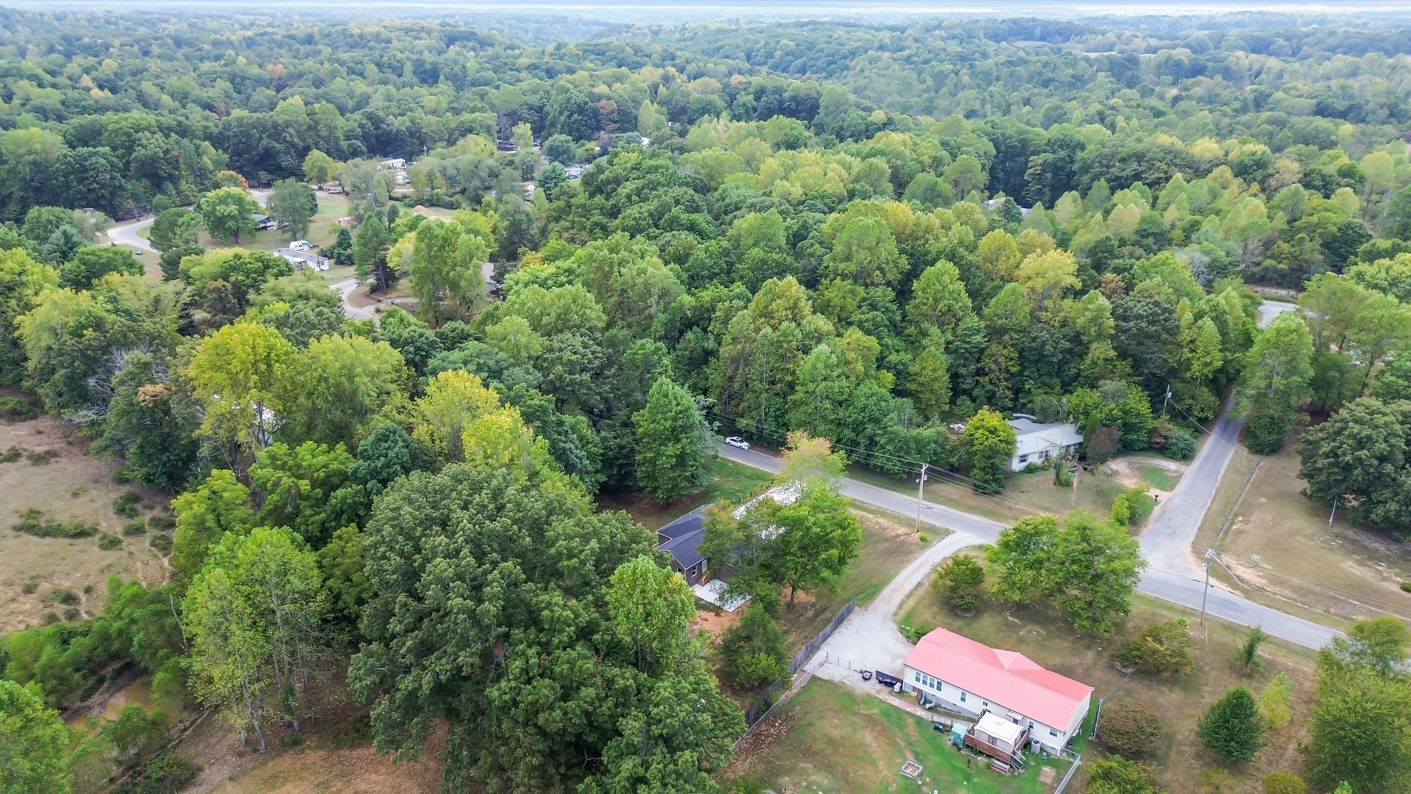 2250 Wayne Road Bon Aqua, TN 37025 - Photo 44 of 48 an aerial view of residential house with outdoor space and trees all around