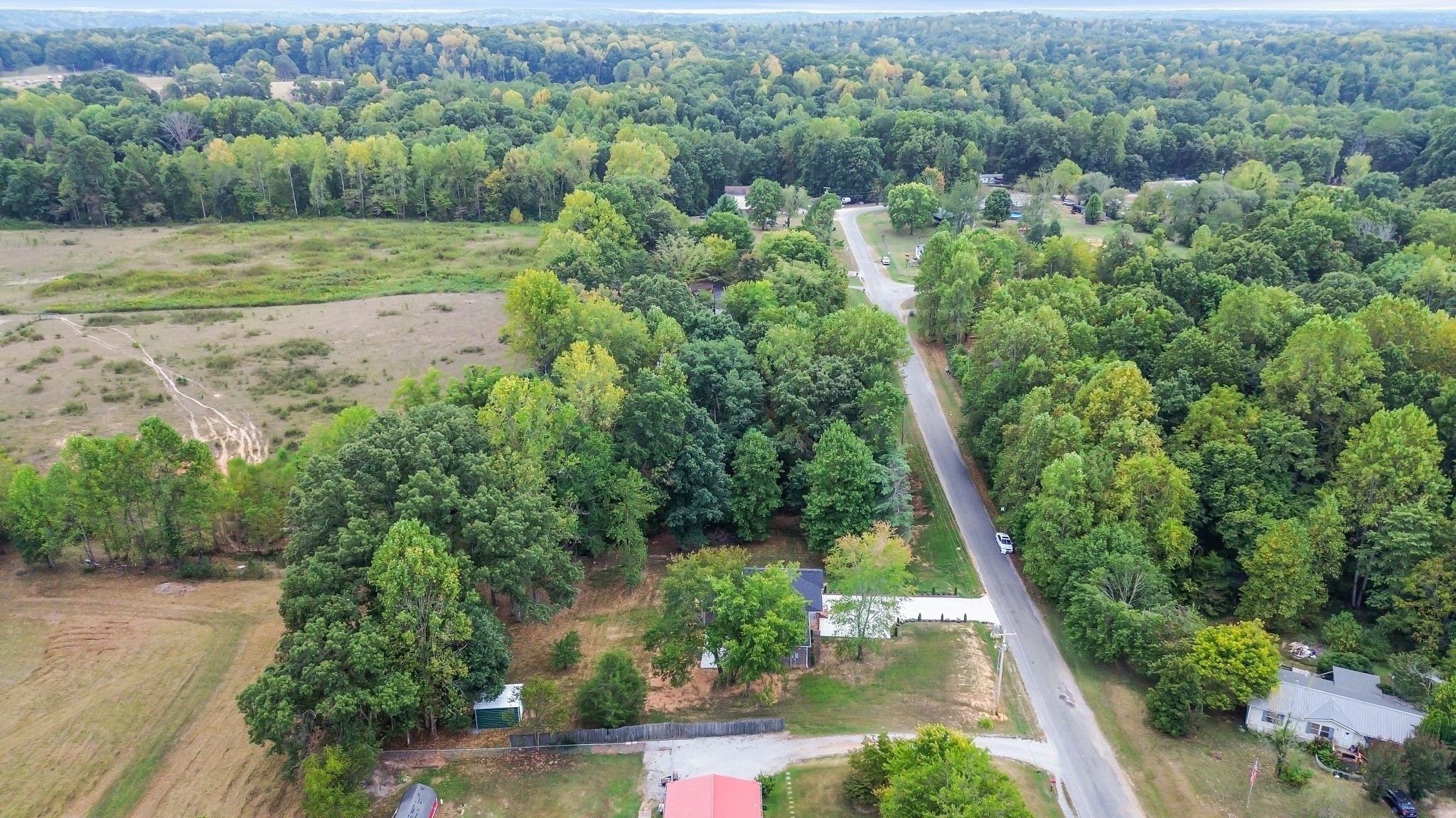 2250 Wayne Road Bon Aqua, TN 37025 - Photo 8 of 48 an aerial view of residential houses with outdoor space and trees