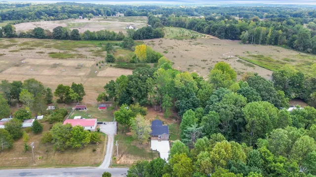 an aerial view of mountain with yard