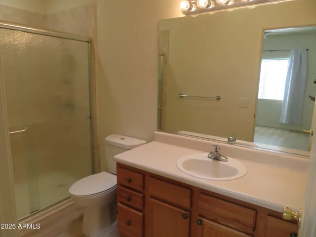 a bathroom with a sink mirror toilet and bathtub