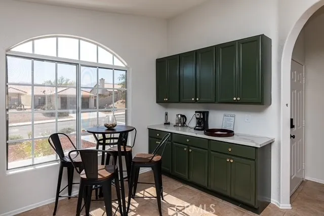a view of a dining room with furniture window and outside view