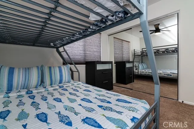 a bed room with a bed and a television