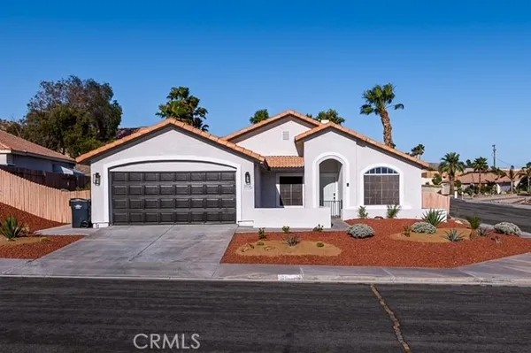 a front view of a house with yard